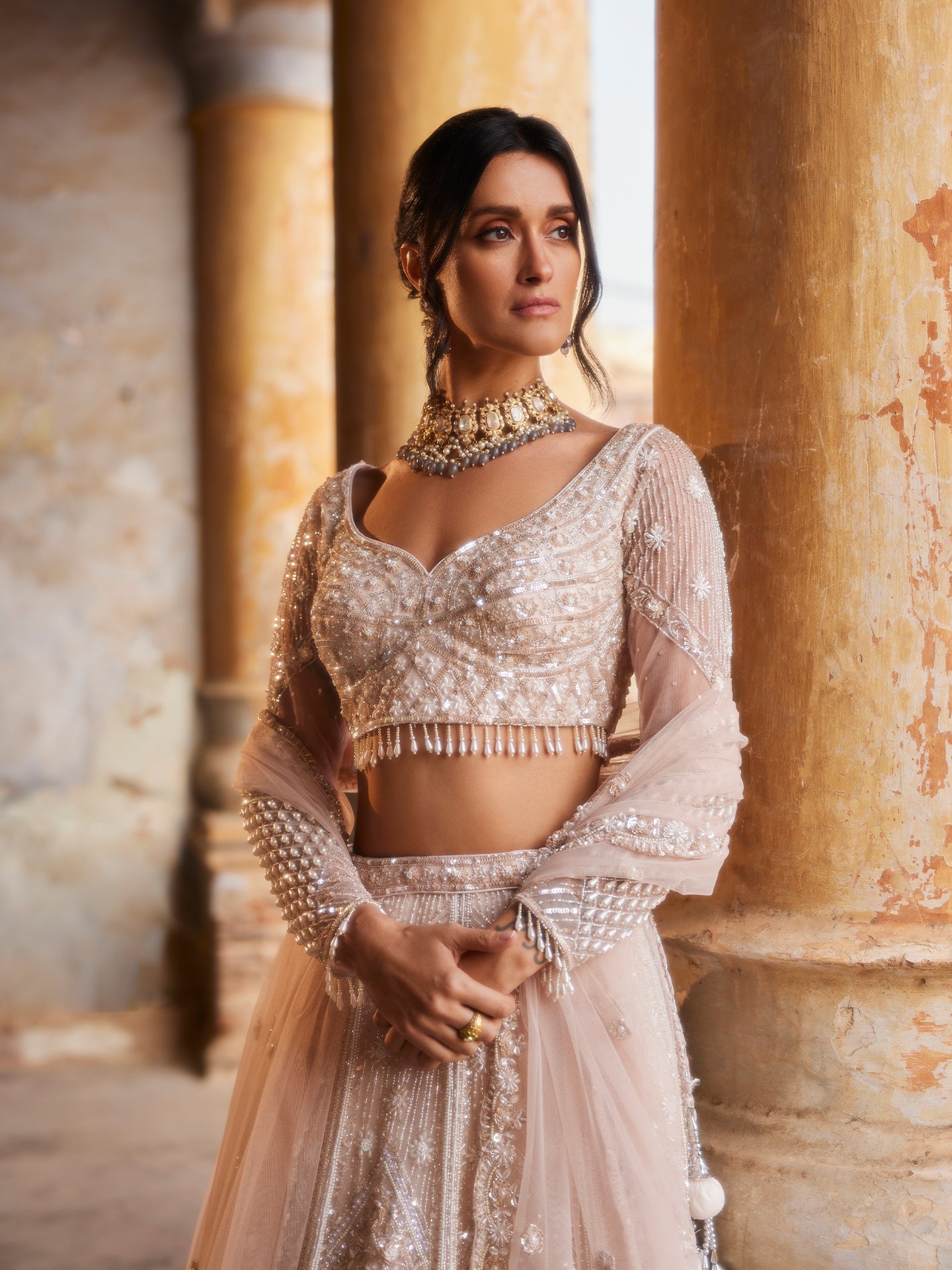 Chic Peach Lehenga in net with Sequence & Pearls Jaal embroidery