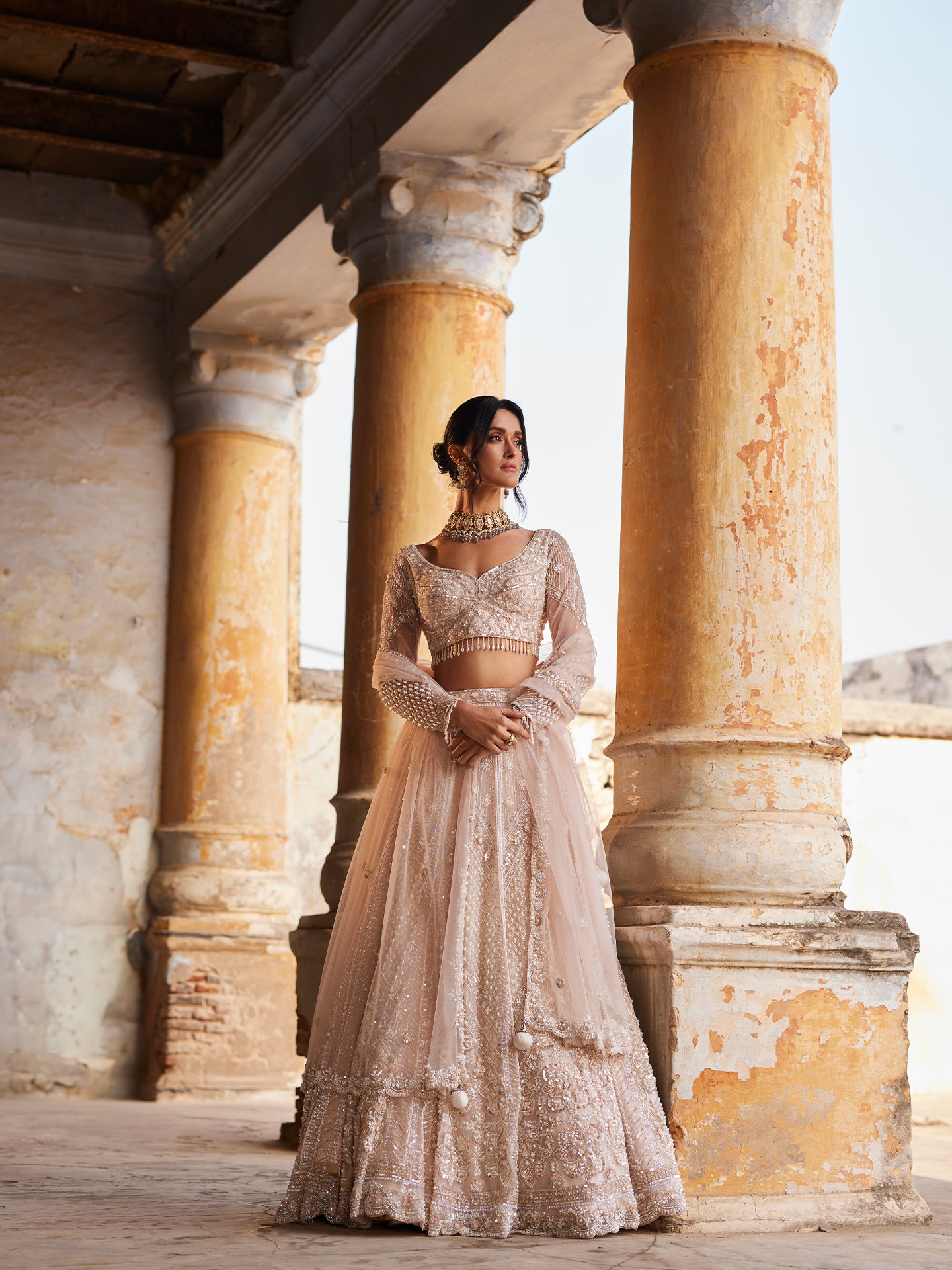 Chic Peach Lehenga in net with Sequence & Pearls Jaal embroidery