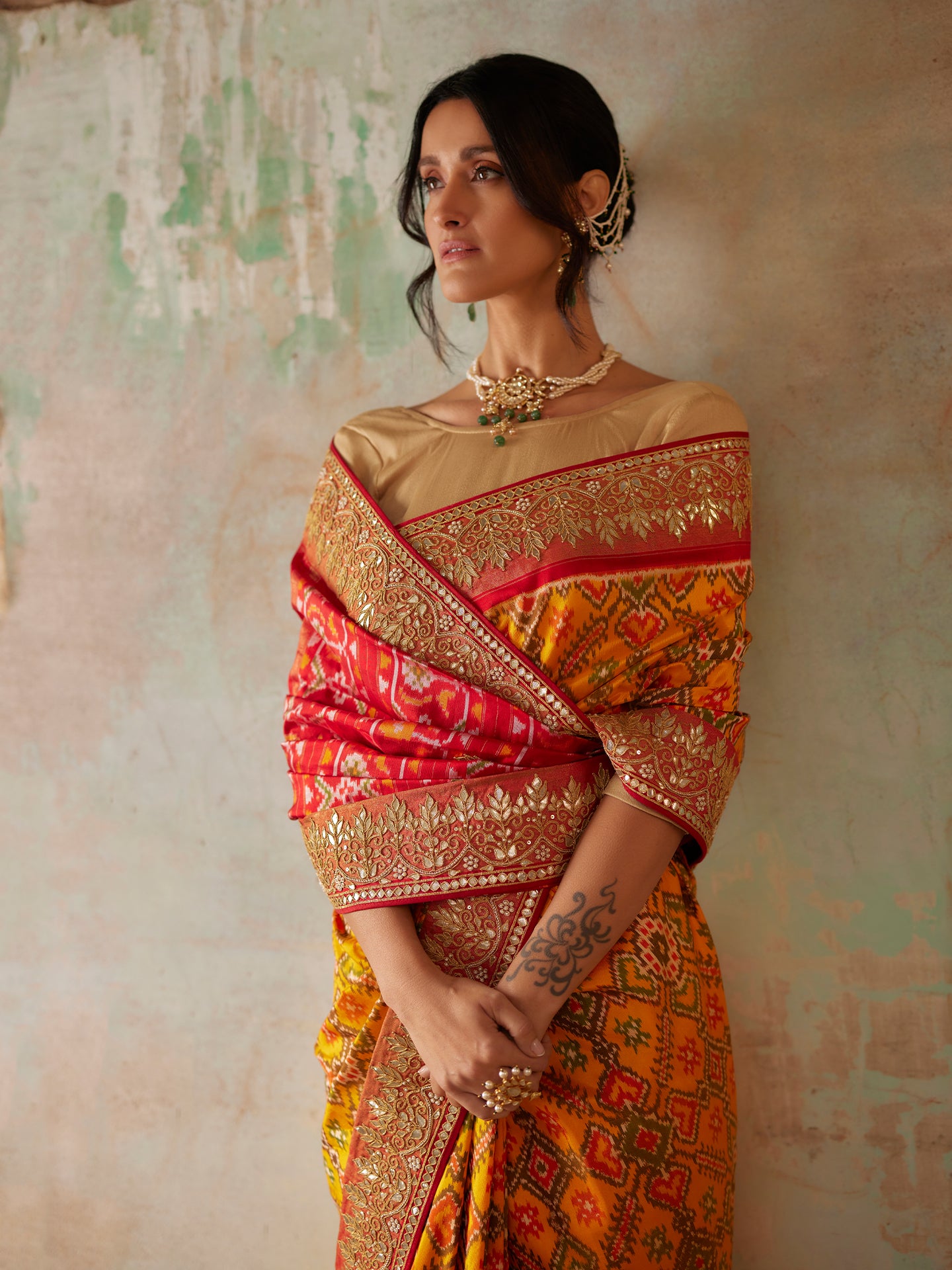 Mustard and Red Saree in Pure Patola Silk with Gota Patti & Pearls embroidery