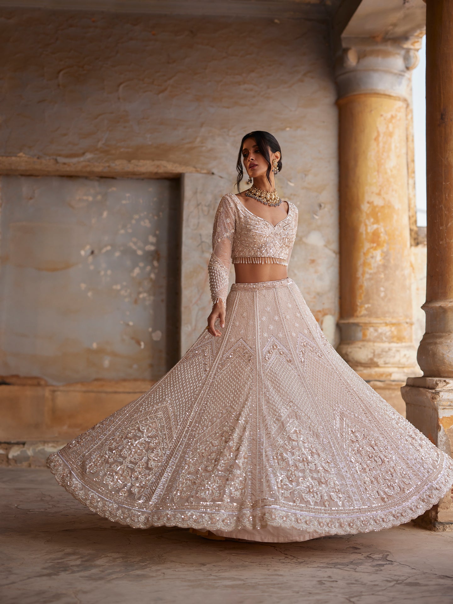 Chic Peach Lehenga in net with Sequence & Pearls Jaal embroidery