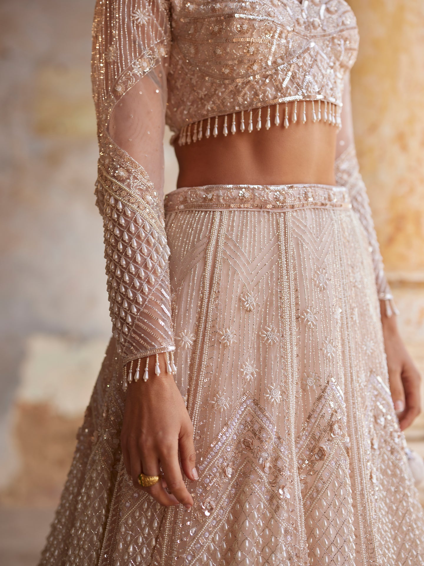 Chic Peach Lehenga in net with Sequence & Pearls Jaal embroidery