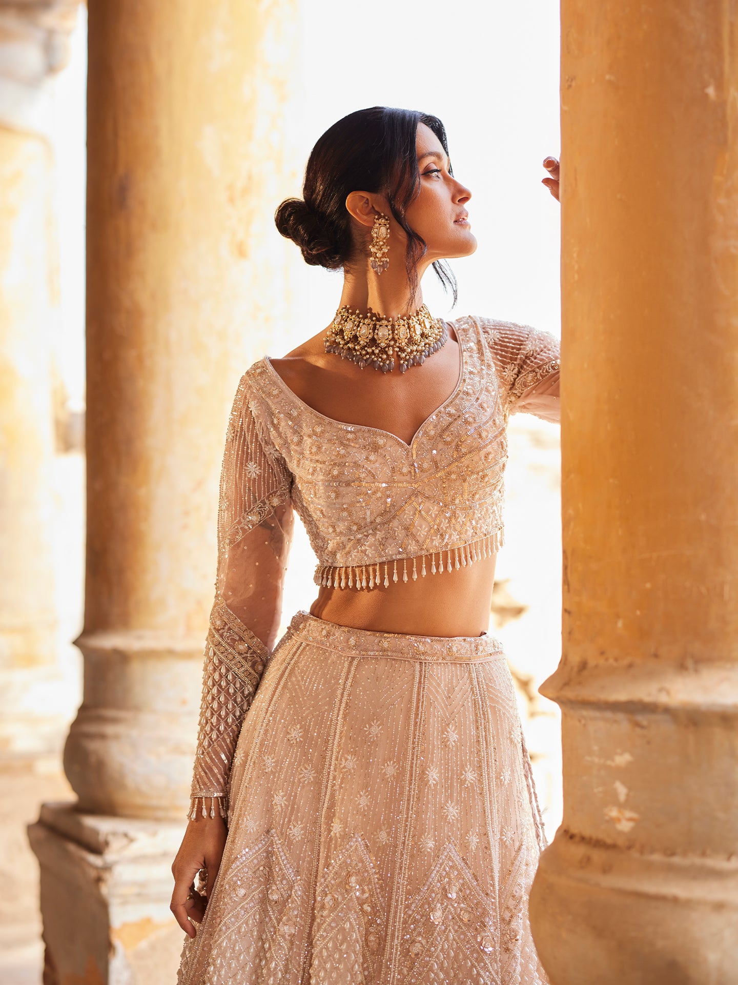 Chic Peach Lehenga in net with Sequence & Pearls Jaal embroidery