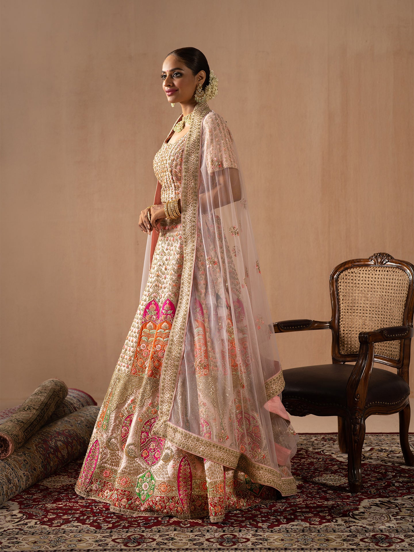 Navratan handwork lehenga in peach colour.