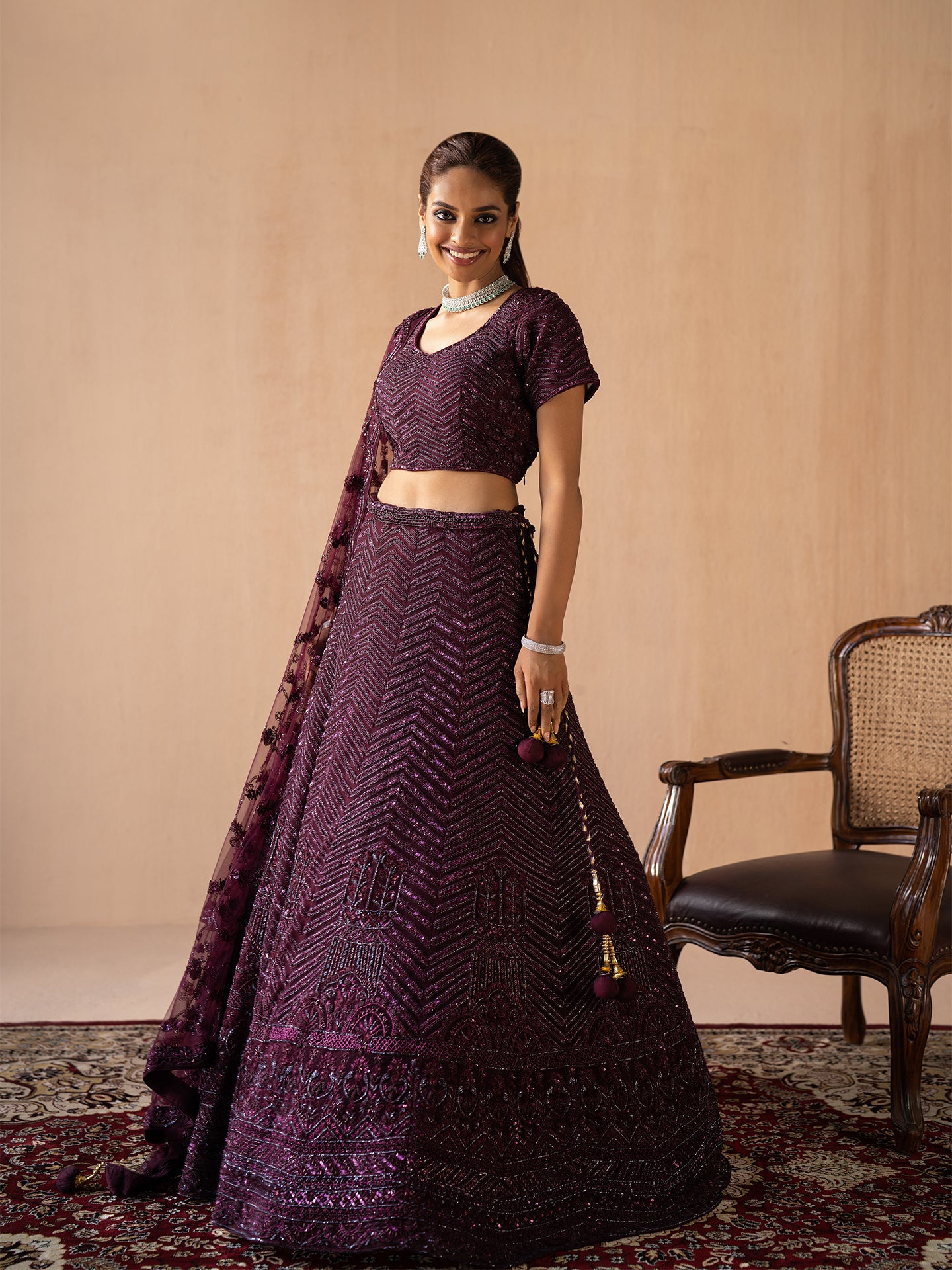 Exquisite handmade lehenga in wine colour.