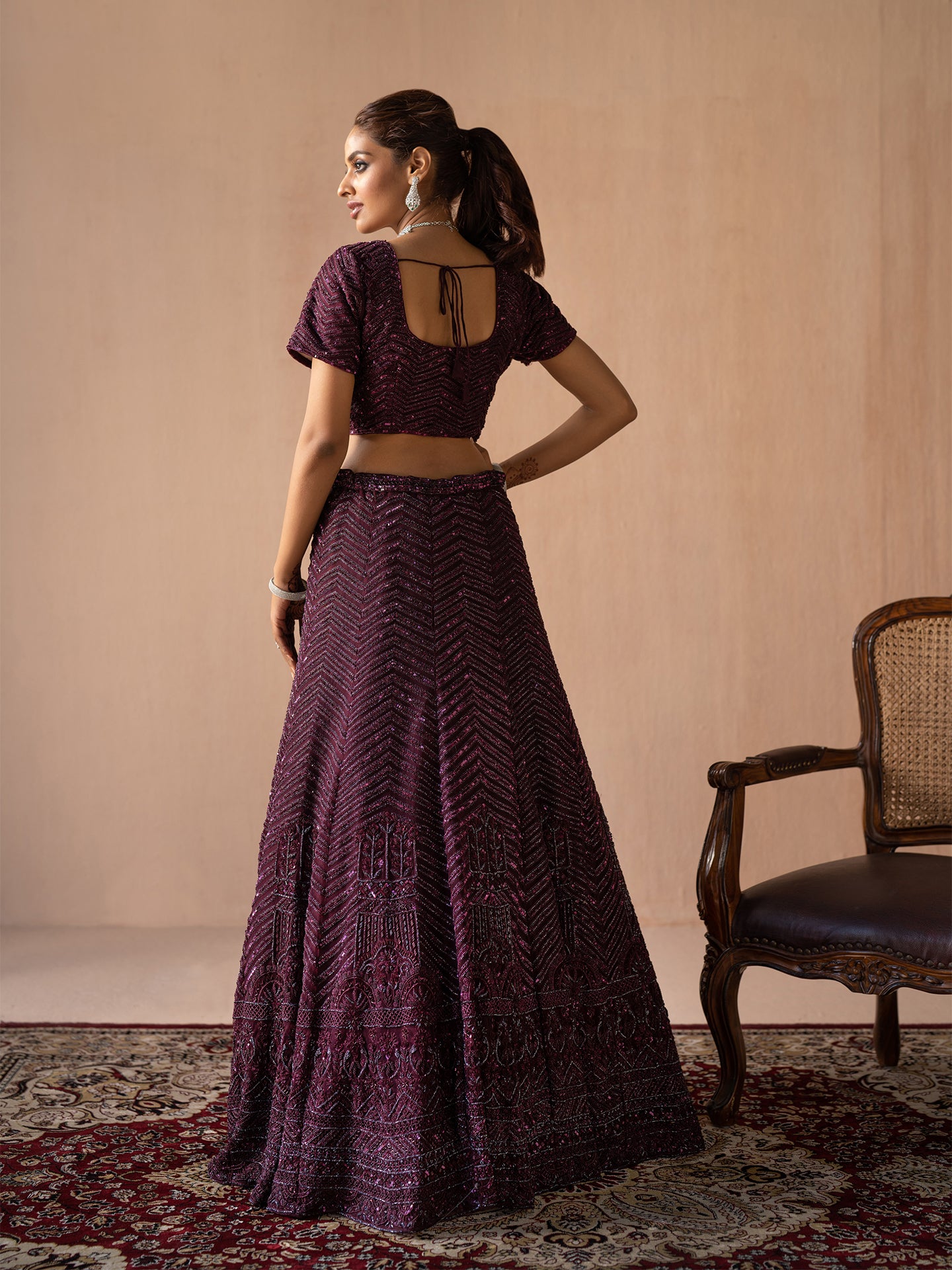 Exquisite handmade lehenga in wine colour.